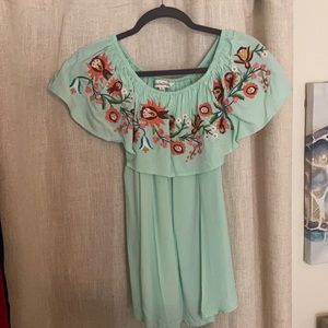 Off the shoulder embroidered blouse.